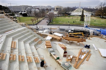 Workers construct the inaugural platform at the west front of ...