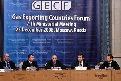 Russia's Prime Minister Vladimir Putin (C) speaks during ...