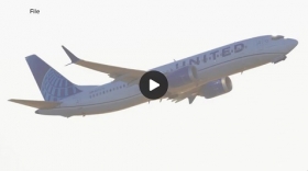 United plane makes emergency landing after mystery object strikes windshield midair